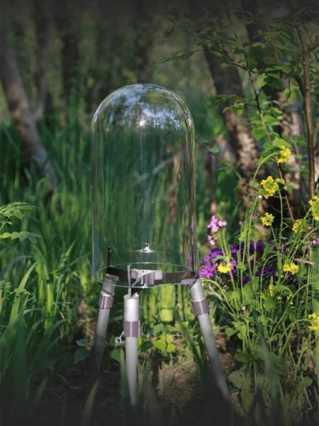 FishView pond dome on aluminium legs in a pond with purple irises
